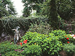 spring border with Pan sculpture